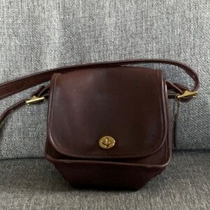 Brown LEATHER GENUINE COACH small Station bag with adjustable strap.